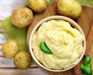 mashed potatoes in a wooden bowl on the table
