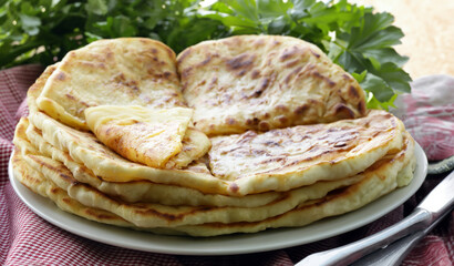 stack of fried tortillas on a plate homemade food