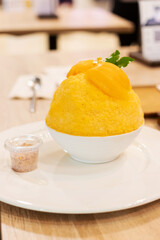Shaved ice with marian plum.  Thailand traditional summer season fruit Marian Plum shaved ice serve in white bowl.