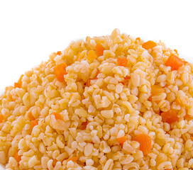 Boiled barley with carrots on plate