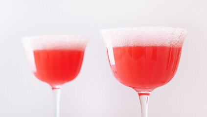 Mimosa alcohol cocktail with red juice and dry champagne
