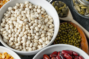 White ceramic bowls with assorted grains on kitchen table