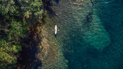 USA, New York, Hague, Flirtation Island, Woman paddleboarding at Lake George