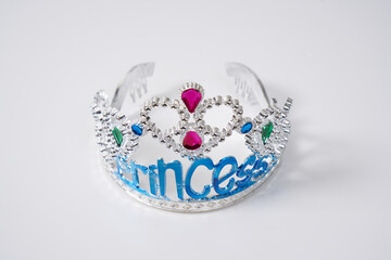 Sparkling tiara of a princess. Toy tiara on a white background. 