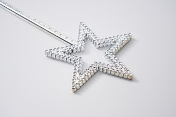 Sparkling star wand of a fairy on a white background.