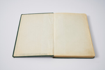 Old dark green notebook from 1950' on a white background.