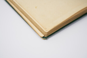 Old dark green notebook from 1950' on a white background.