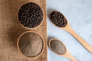Ground black pepper with grains of black pepper,top view