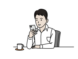 くつろぎながらスマートフォンを見る若い男性