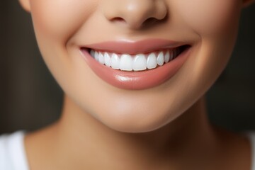 Perfect white healthy teeth of a smiling woman close-up. Portrait with selective focus and copy...