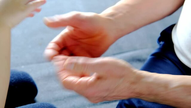 adult male hands holding kid hands, Family Help Care Concept, small hands in fathers hand, touching moment, touch of child and old man, grandfather, parents and child, adopted children, adoption