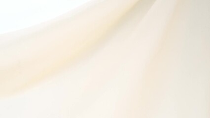 silk fabric, beige pastel color forms beautiful folds in air in slow motion, texture of woven weave soft folds, ripples delicate silks slowly moving, background, test, image for fashion luxury design - Powered by Adobe