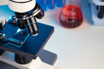 Microscope lenses on a laboratory desk close up