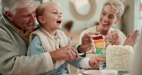 Birthday party, cake and a child with family to celebrate and cut rainbow slice together for dessert. Clapping, surprise and social gathering with people, grandparents and happy kids at table for fun - Powered by Adobe