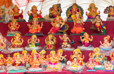 Fototapeta na wymiar Indian Hindu God Lord Ganesha Statues, Coated with colors and sold for Ganesh Chathurthi