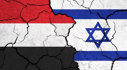 Foto op Plexiglas Flags of Yemen and Israel on cracked surface - politics, relationship concept © PX Media
