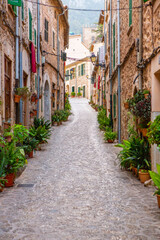 Fototapeta premium View of a medieval street of the picturesque Spanish-style village Valdemossa in Majorca or Mallorca island, Spain.