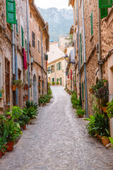 View of a medieval street of the picturesque Spanish-style village Valdemossa in Majorca or Mallorca island, Spain.