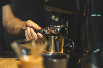 Fototapeta na wymiar The process of making coffee on a coffee machine. Espresso machine. barista Fragrant morning coffee. Caffeine. Addiction to coffee.