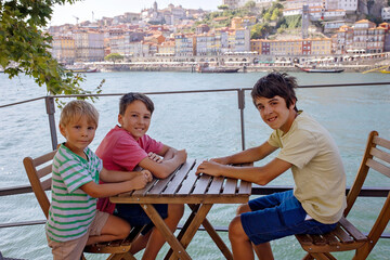 Happy family, visiting Lisbon during summer holiday, people with children, enjoying cityscape