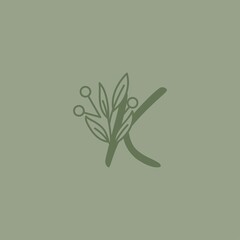logo letter K with green tree branch