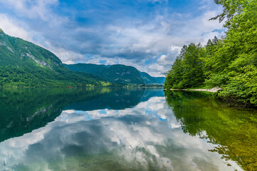 Fototapeta na wymiar A view from the southern shore across lake Bohinj, Slovenia in summertime