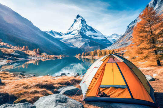 In the majestic Matterhorn region, hikers enjoy a thrilling trekking vacation, setting up their tents at a scenic campsite to immerse themselves in the beauty of nature.