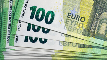100 euro bills. Top view of a stack of hundred Euro notes. Close-up. The single currency of the...