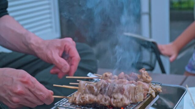 Yakitori that looks delicious sizzling over charcoal fire