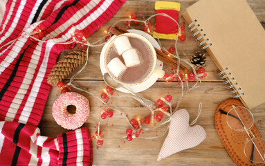 cup with drink coffee cappuccino, hot chocolate, marshmallows, garlands, winter clothes, caffeine...