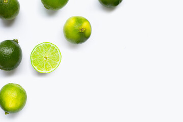 Fresh limes with leaves isolated on white