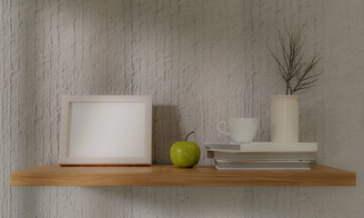 Small square wooden frame mockup in interior with trailing green apple, and shelf on empty neutral white wall background. 3d rendering illustration