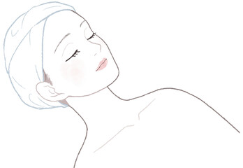 仰向けでエステを受ける女性