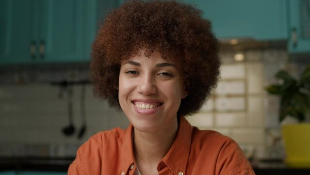 Black Woman Smiling Looking at Camera. Millennial African American female portrait.
