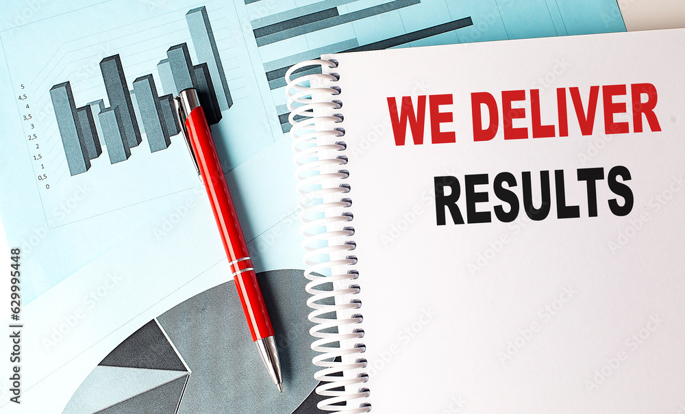 Aufkleber we deliver results text on a notebook with pen on a chart background