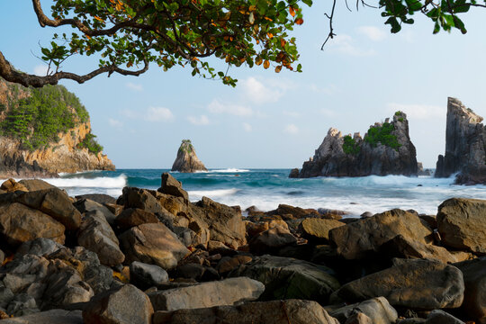 photo of pantai batu layar or pantai gigi hiu at kelumbayan tanggamus lampung, high quality images good for background. long exposure shoot on exotic beach. summer natural rocks corals daylight