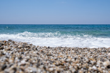 Sea waves run on the shore of the sea or ocean. Beautiful relaxing view on vacation.