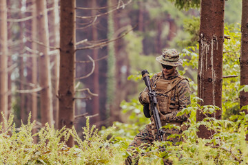 A modern warfare soldier on war duty in dense and dangerous forest areas. Dangerous military rescue...