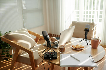 Table and two chairs prepared for making podcast