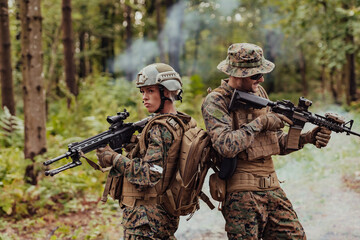 Fototapeta premium Modern Warfare Soldiers Squad Running in Tactical Battle Formation Woman as a Team Leader