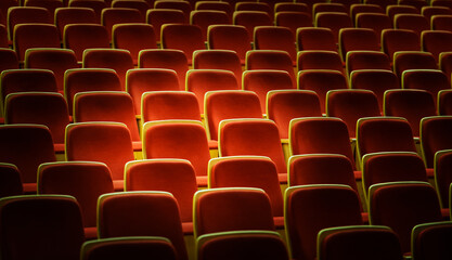Line of red theater chairs for background