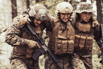 Modern warfare military squad in battle action rescue wounded soldier help and support concept