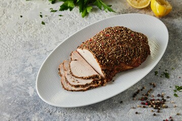 Overhead shot of a large white plate filled with savory slices of turkey covered in crunchy breading
