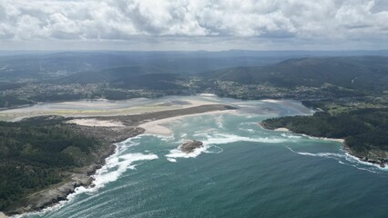 Aerial view of a beautiful seascape in Galicia against the cloudy sky