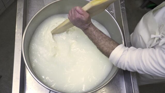 Process of making cheese from milk in a saucepan by a cook