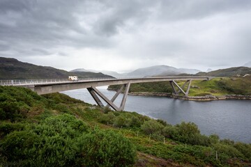 Fototapeta na wymiar Kylesku Bridge in Northern Scotland, on the NC 500 Tourist Driving Route.