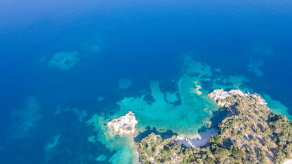 Naklejka na ściany i meble Aerial view of sea waves and fantastic Rocky coast, Greece