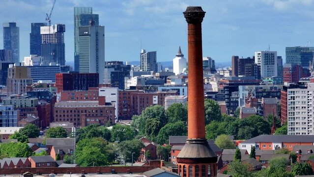 Manchester Skyline panoramic view showing red brick old warehouse and chimney. 