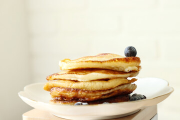Fritters with berries lie on a plate