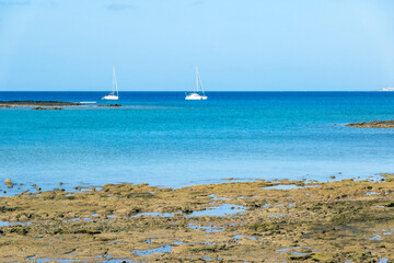 Fototapeta na wymiar Yachts in the turquoise waters of Arrecife, Lanzarote, Las Palmas, Canary Islands, Spain.